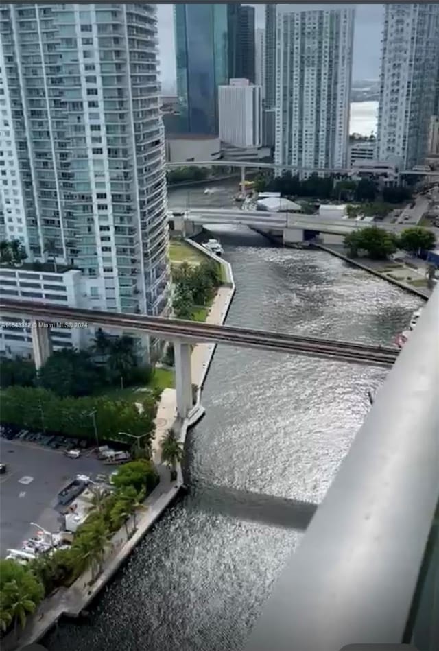 view of community with a water view