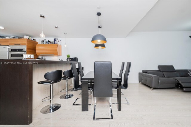 dining space featuring light hardwood / wood-style flooring