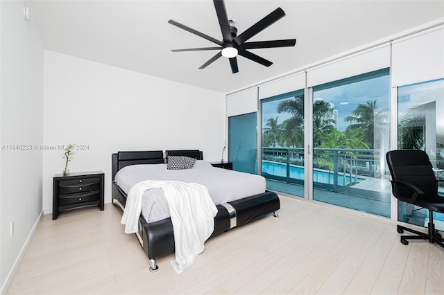 bedroom featuring ceiling fan, access to exterior, and light hardwood / wood-style floors