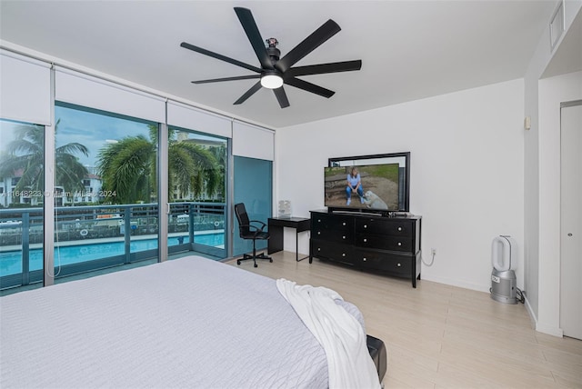 bedroom featuring ceiling fan and access to exterior