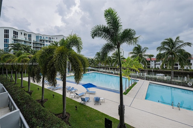 view of swimming pool with a patio area and central AC