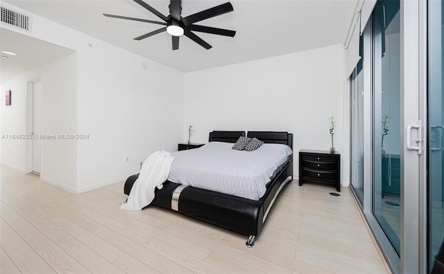 bedroom with ceiling fan and light wood-type flooring