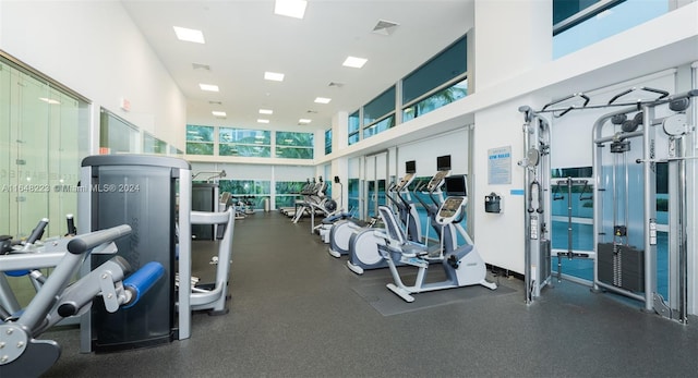 gym with a towering ceiling