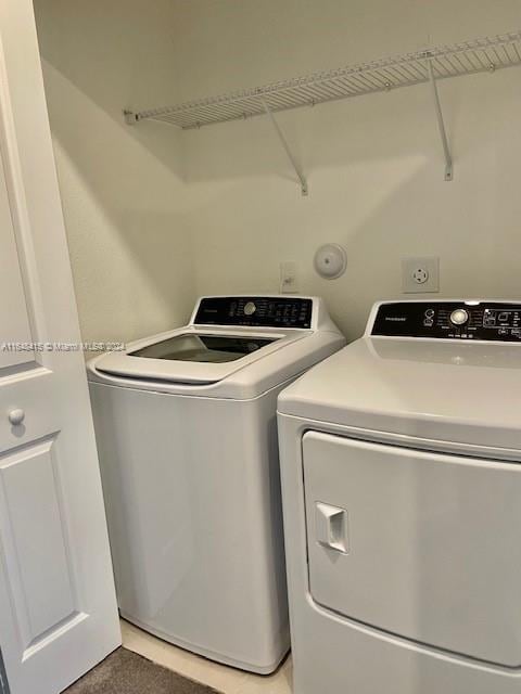 washroom featuring separate washer and dryer