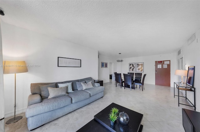 living room with a textured ceiling