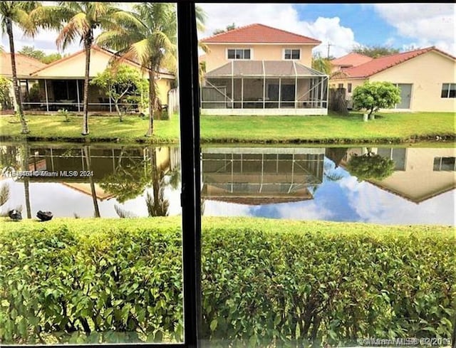 exterior space featuring a yard and a water view