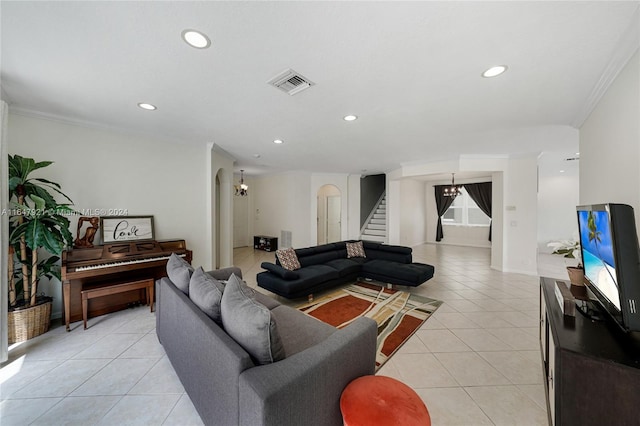 living room with light tile patterned floors and ornamental molding