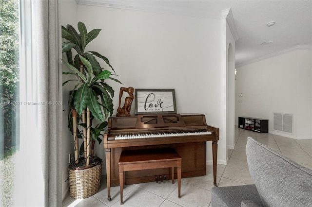 misc room with light tile patterned flooring and crown molding