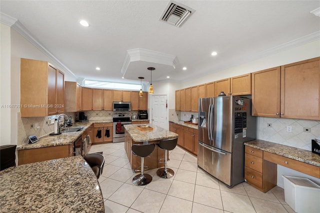 kitchen with a center island, tasteful backsplash, appliances with stainless steel finishes, decorative light fixtures, and ornamental molding