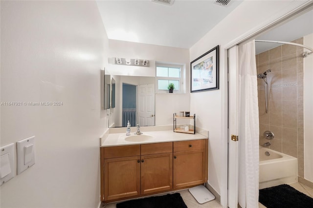 bathroom featuring vanity, tile patterned flooring, and shower / tub combo with curtain