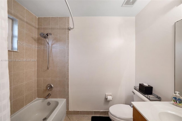 full bathroom with shower / bath combo, tile patterned flooring, vanity, and toilet