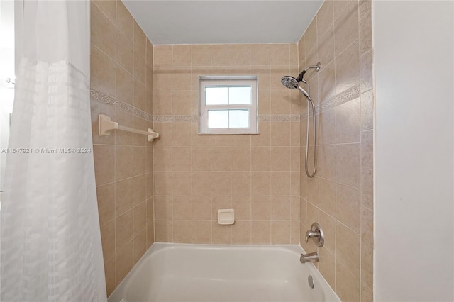 bathroom with shower / tub combo