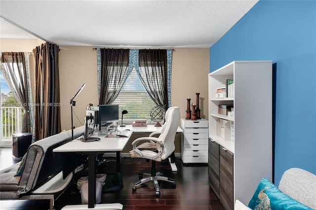 office area featuring a textured ceiling and dark wood-type flooring