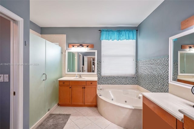 bathroom with vanity, tile walls, tile patterned flooring, and separate shower and tub