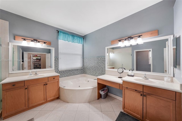 bathroom featuring vanity, a bathing tub, and tile patterned floors