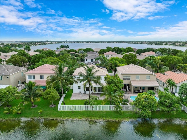 birds eye view of property featuring a water view