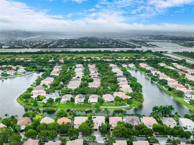 drone / aerial view with a water view