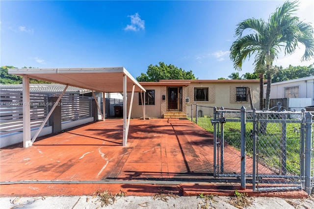 view of front of home with a carport