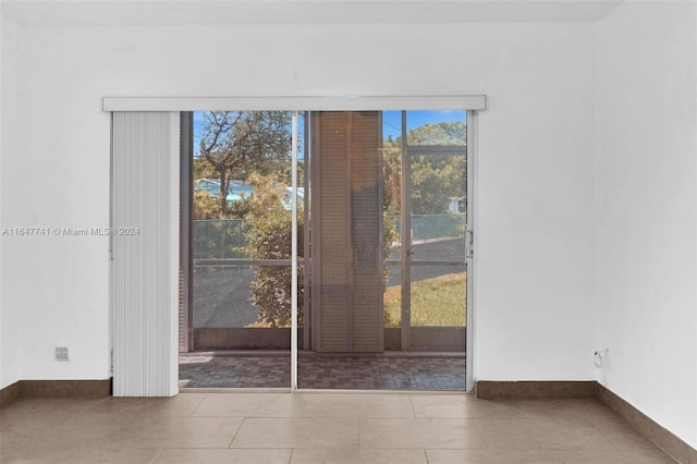 doorway featuring light tile patterned floors