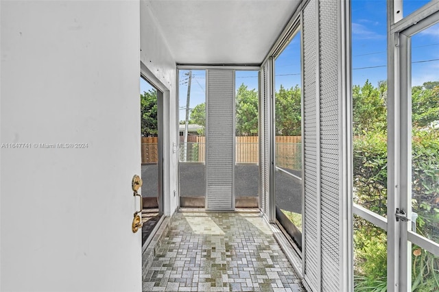 unfurnished sunroom featuring a healthy amount of sunlight