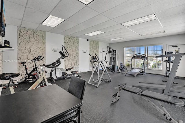 exercise room featuring a paneled ceiling