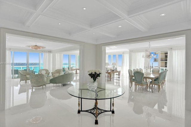 interior space with a water view, a chandelier, beamed ceiling, and coffered ceiling