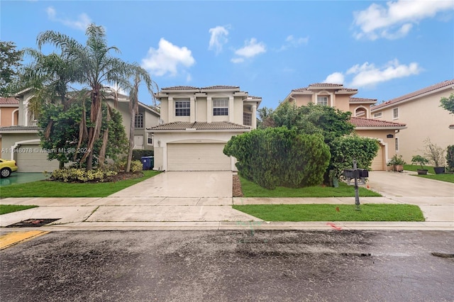 mediterranean / spanish home with concrete driveway, a garage, and stucco siding