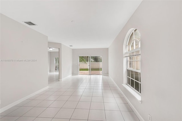 spare room featuring light tile patterned floors