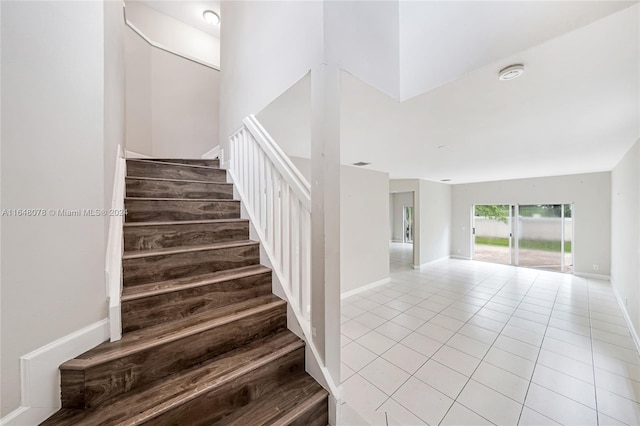 stairway featuring tile patterned floors