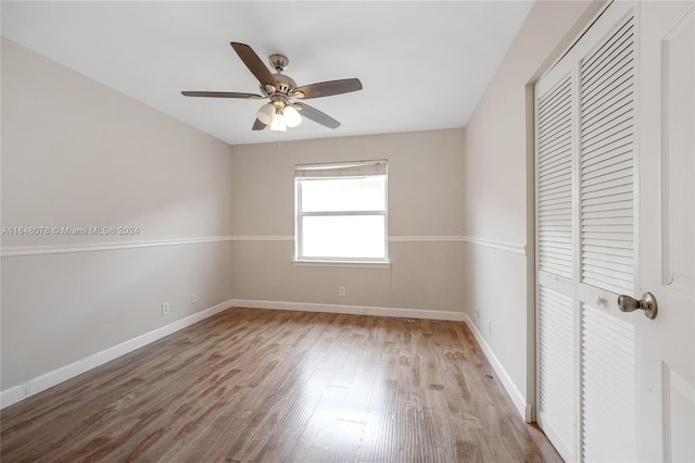 interior space with wood-type flooring and ceiling fan