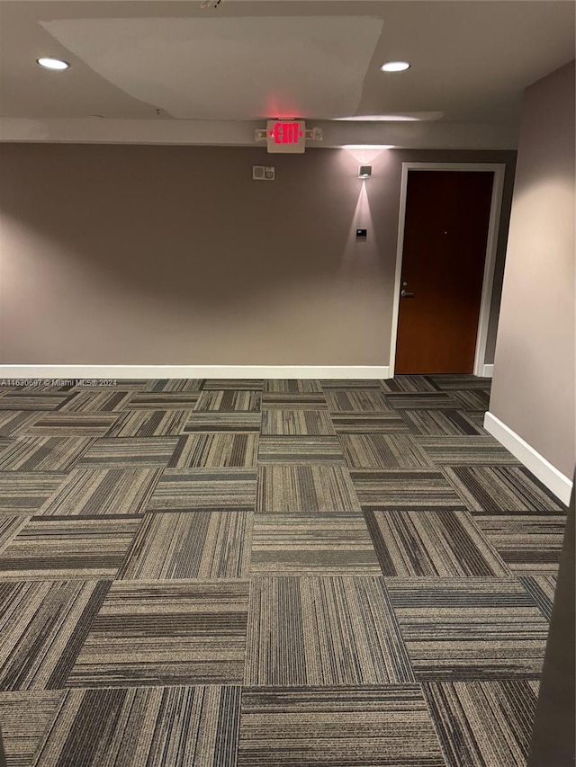 interior space featuring dark carpet