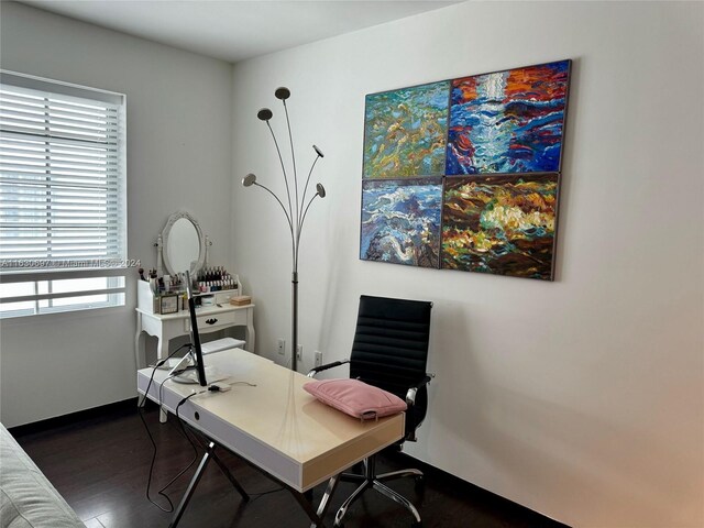 home office with dark wood-type flooring