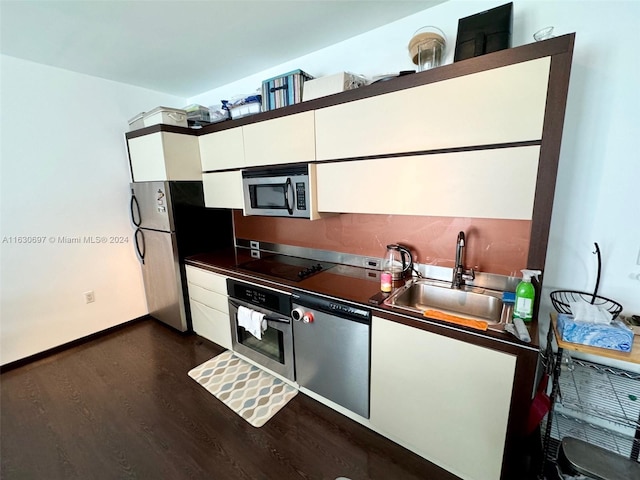 kitchen featuring white cabinets, sink, dark wood-type flooring, and appliances with stainless steel finishes