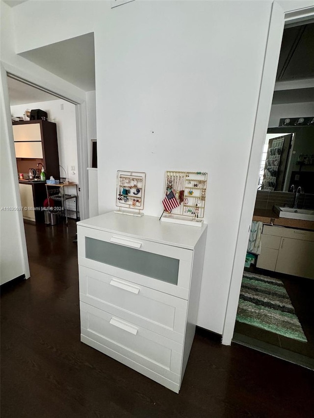 interior details with sink and hardwood / wood-style flooring