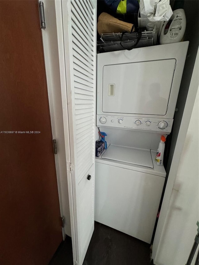 clothes washing area with stacked washer / drying machine