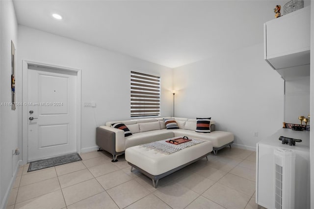 living room with recessed lighting, baseboards, and light tile patterned floors
