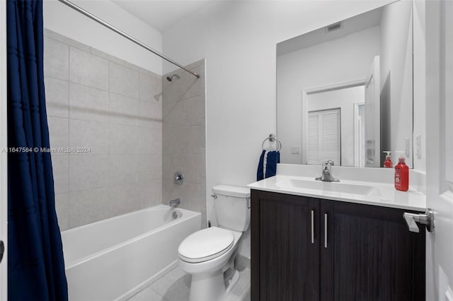 bathroom with tile patterned floors, toilet, visible vents, shower / tub combo, and vanity