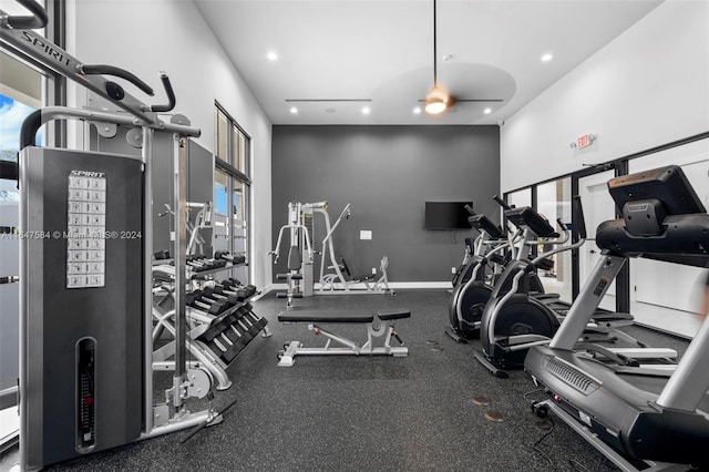 gym with ceiling fan and recessed lighting