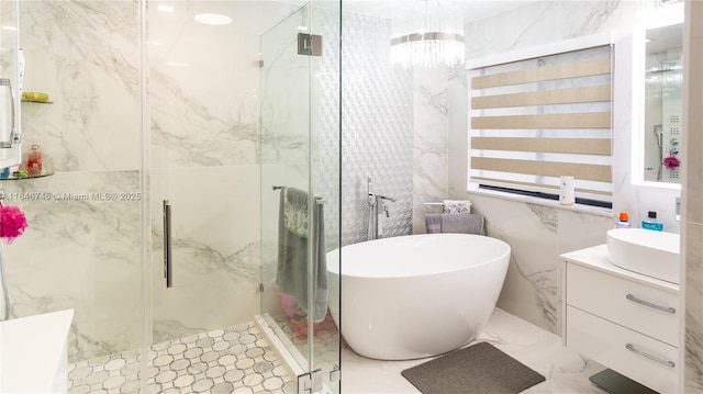 8886 NW 187th St, Miami, FL 33018 - bathroom with a marble finish shower, marble finish floor, a freestanding tub, and vanity