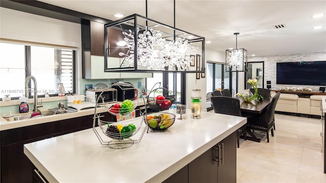 8886 NW 187th St, Miami, FL 33018 - kitchen featuring a notable chandelier, open floor plan, light countertops, visible vents, and a sink