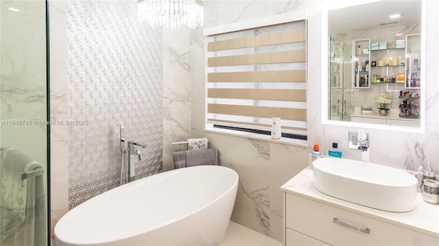 8886 NW 187th St, Miami, FL 33018 - full bath featuring a notable chandelier, vanity, a soaking tub, visible vents, and tile walls
