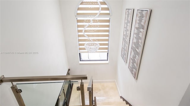 8886 NW 187th St, Miami, FL 33018 - stairs with a chandelier and baseboards
