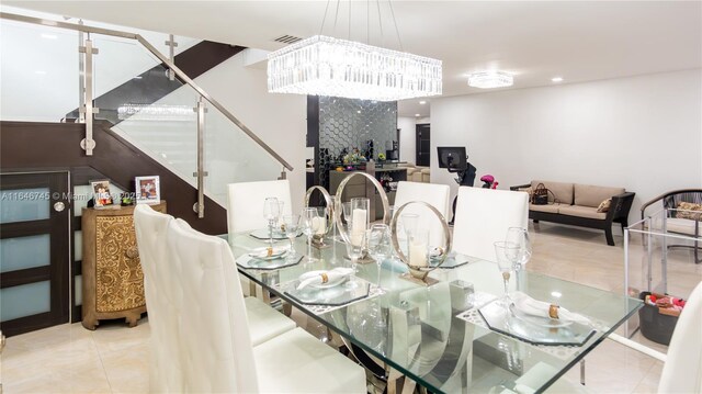 tiled dining space with an inviting chandelier