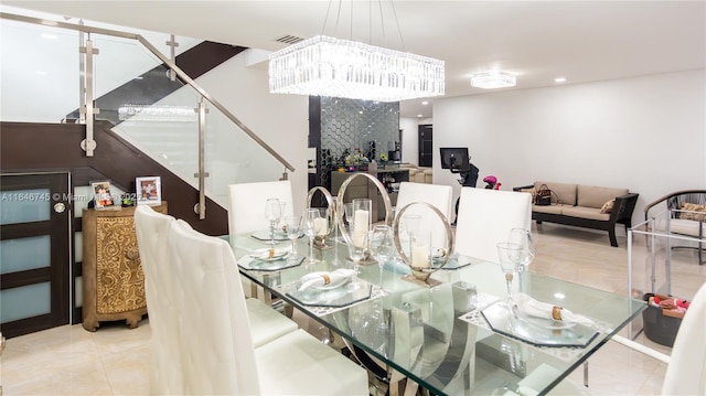 8886 NW 187th St, Miami, FL 33018 - dining space featuring visible vents, recessed lighting, a chandelier, stairs, and tile patterned floors