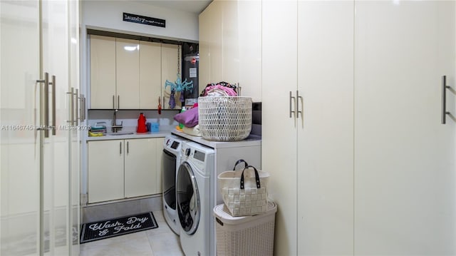 8886 NW 187th St, Miami, FL 33018 - laundry room with water heater, light tile patterned flooring, independent washer and dryer, cabinet space, and a sink