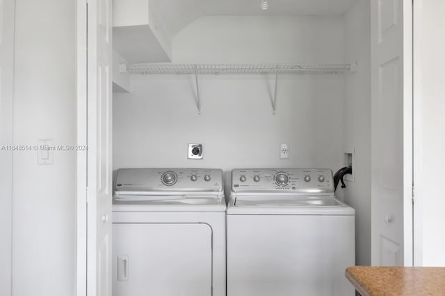 laundry room with independent washer and dryer