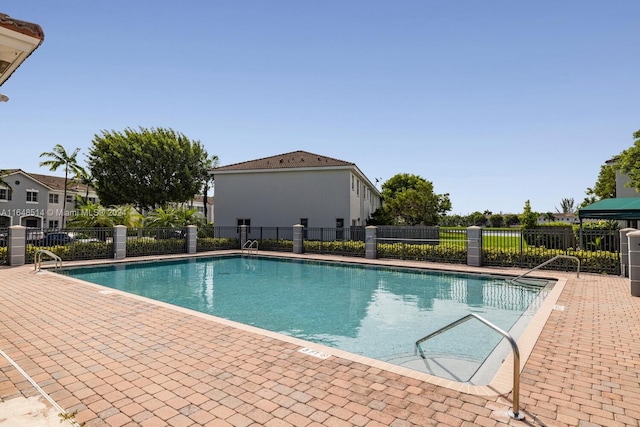 view of swimming pool featuring a patio area