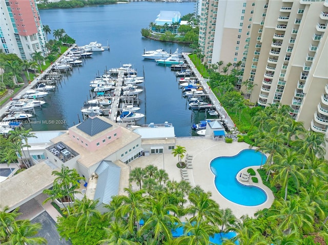 birds eye view of property with a water view