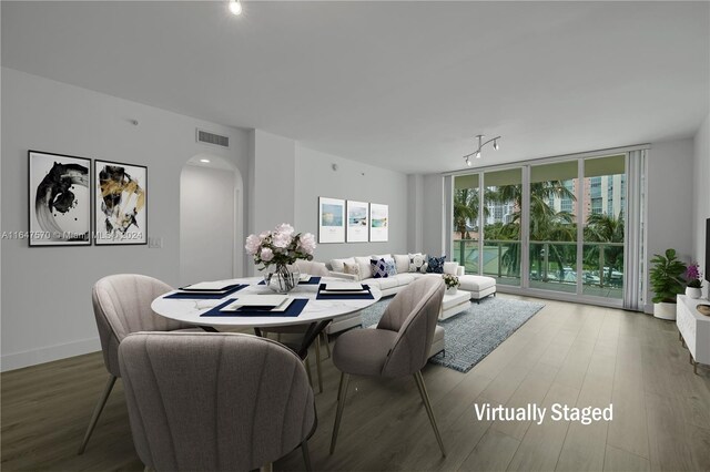 dining space featuring hardwood / wood-style floors