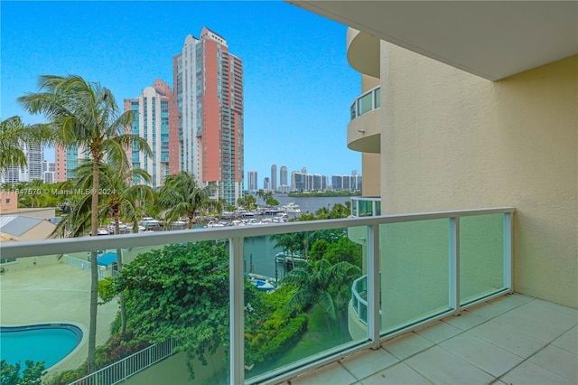 balcony with a fenced in pool